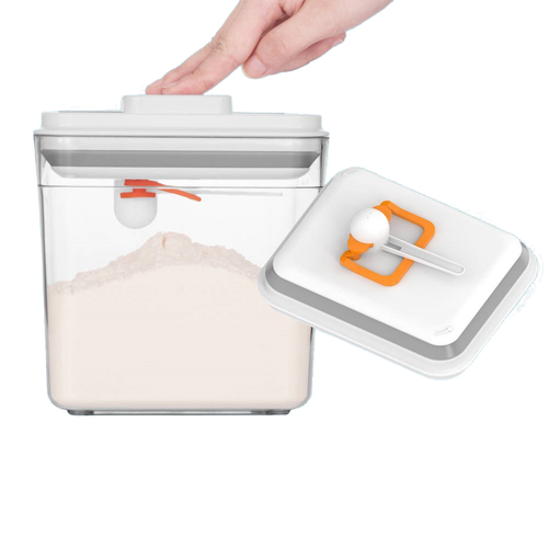 Scoop & Seal container being pressed shut, lid beside it with the scoop held in its clip